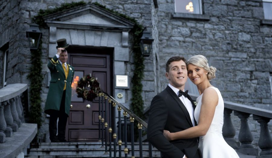 Bride & Groom with Doorman Outside Glenlo Abbey
