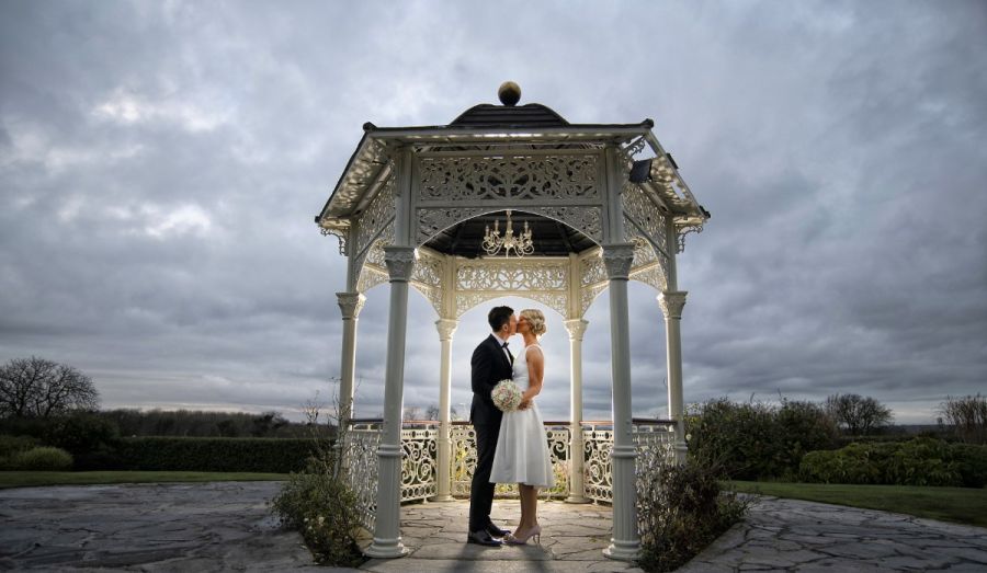 Bride & Groom in the Gazebo at Sunset