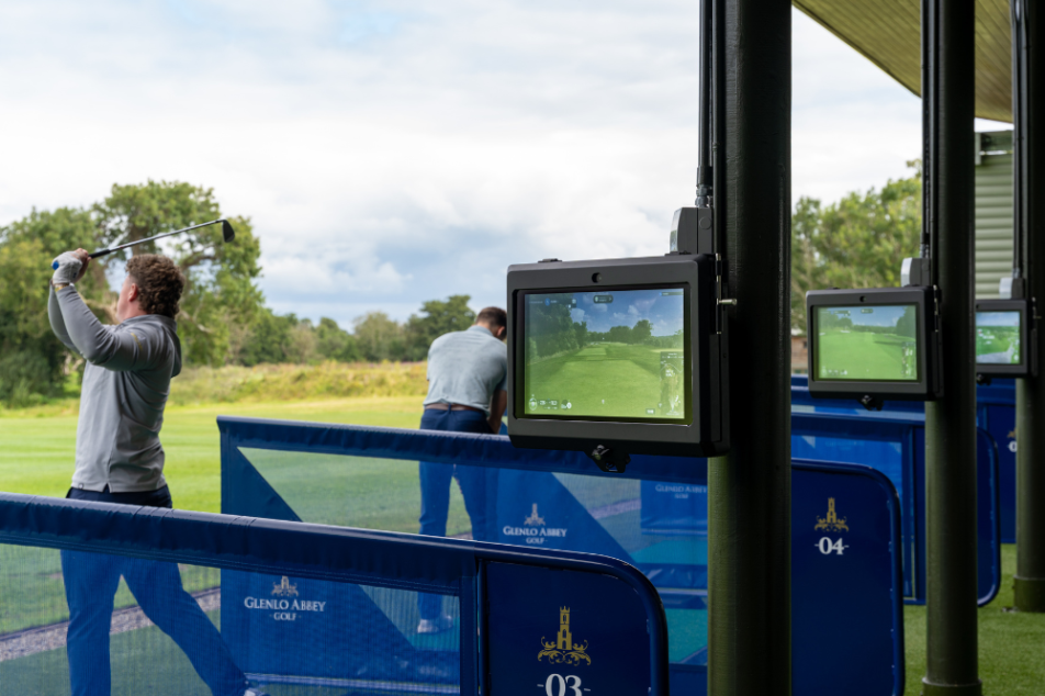Trackman 2 Golfers - 1 Swinging - Primary Gallery